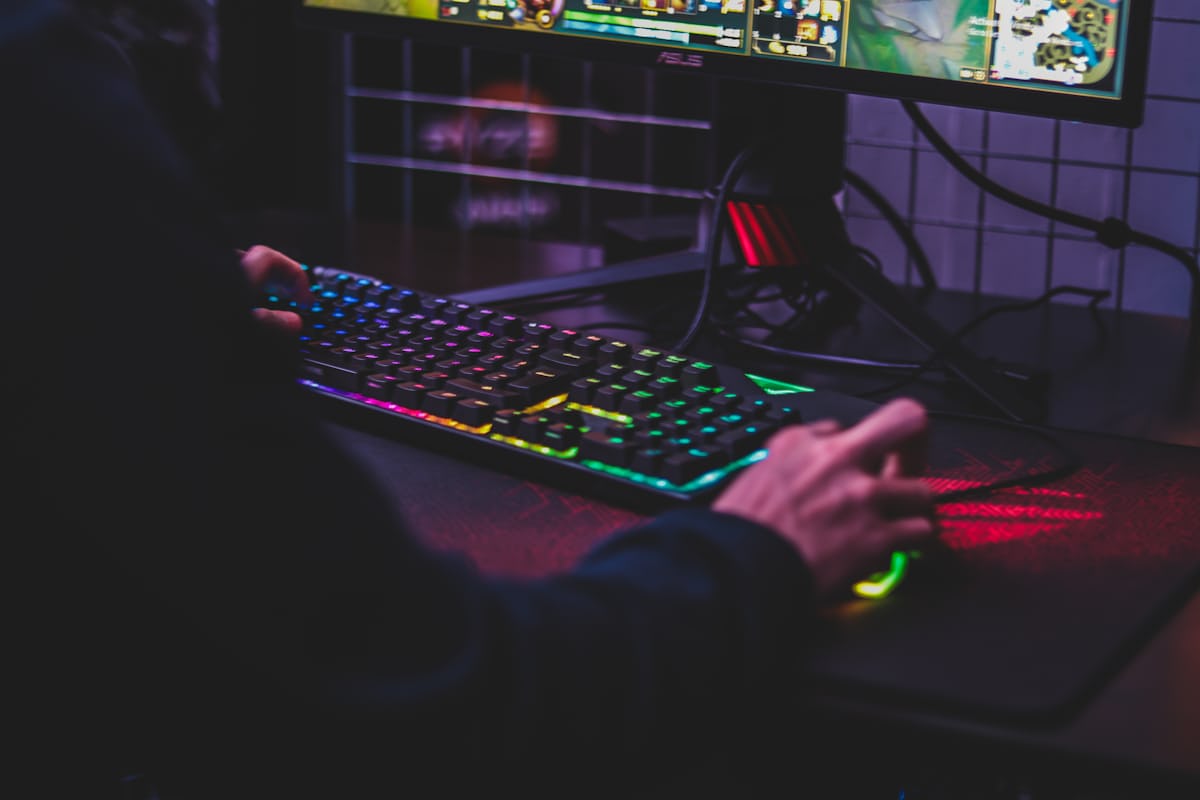 Gaming blog workspace with keyboard and notes
