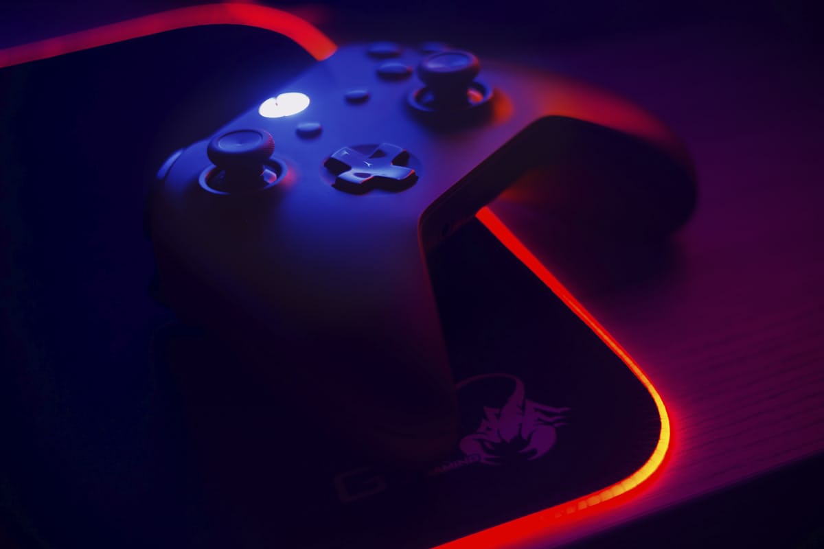 Gaming desk with controller and ambient lighting